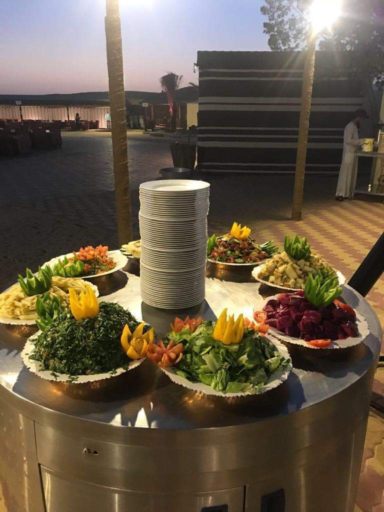 Evening dining setup in the desert by Royal Viking Tourism.