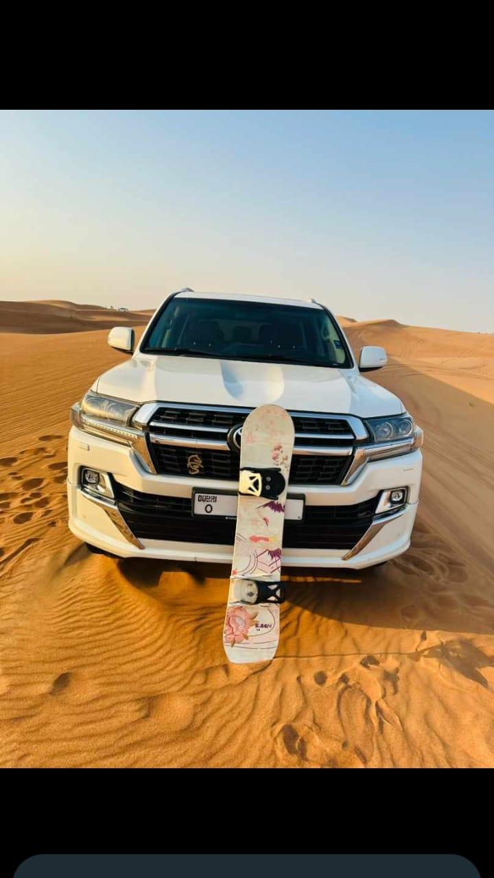 4x4 vehicle with sandboard during Dubai desert safari by Royal Viking Tourism.