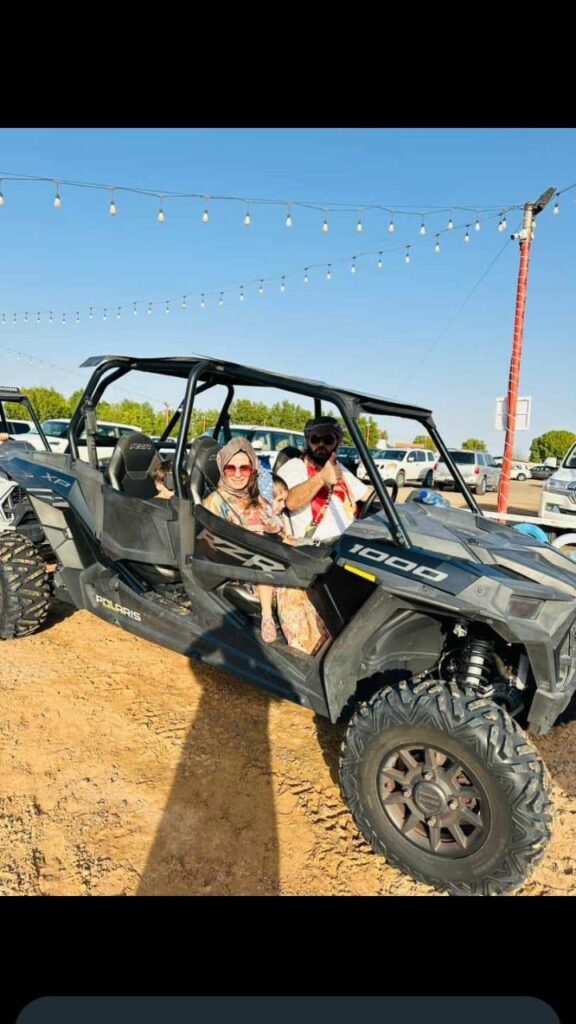 Family enjoying a dune buggy ride during Dubai desert safari by Royal Viking Tourism.