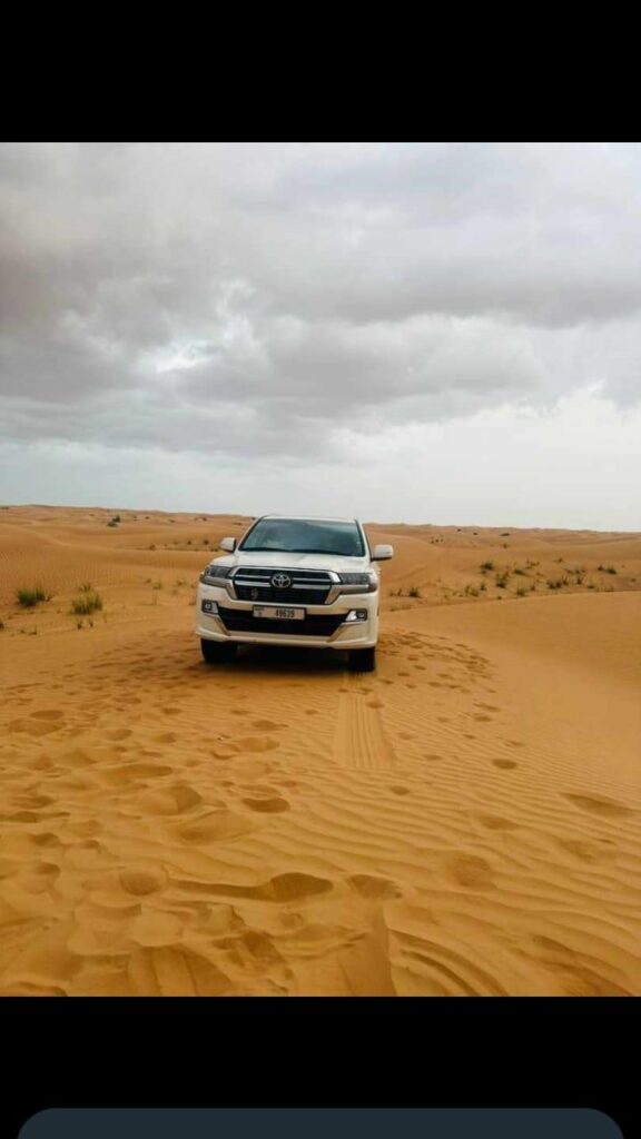 4x4 vehicle navigating the Dubai desert during a safari by Royal Viking Tourism.