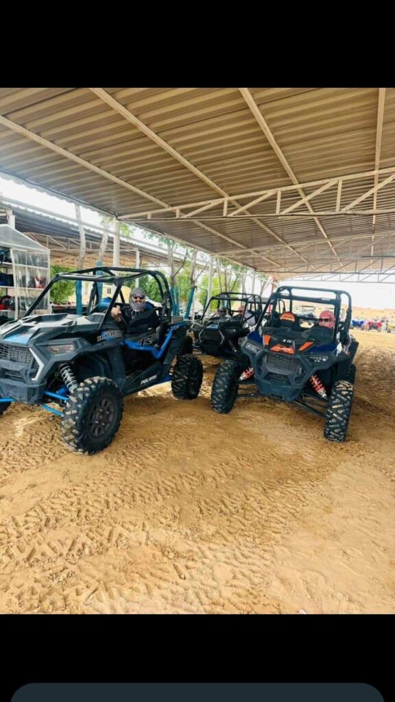 Family enjoying an ATV adventure during a desert safari by Royal Viking Tourism.