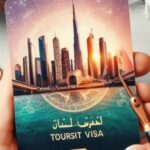 Hand holding a tourist visa card with an artistic illustration of Dubai's skyline.